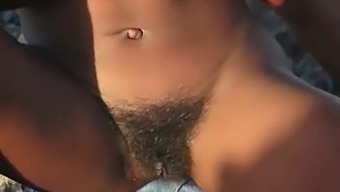 African-American Woman Delights In Outdoor Pleasure